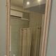 large antique mirror with richly carved pediment in Louis XV / Napoleon style