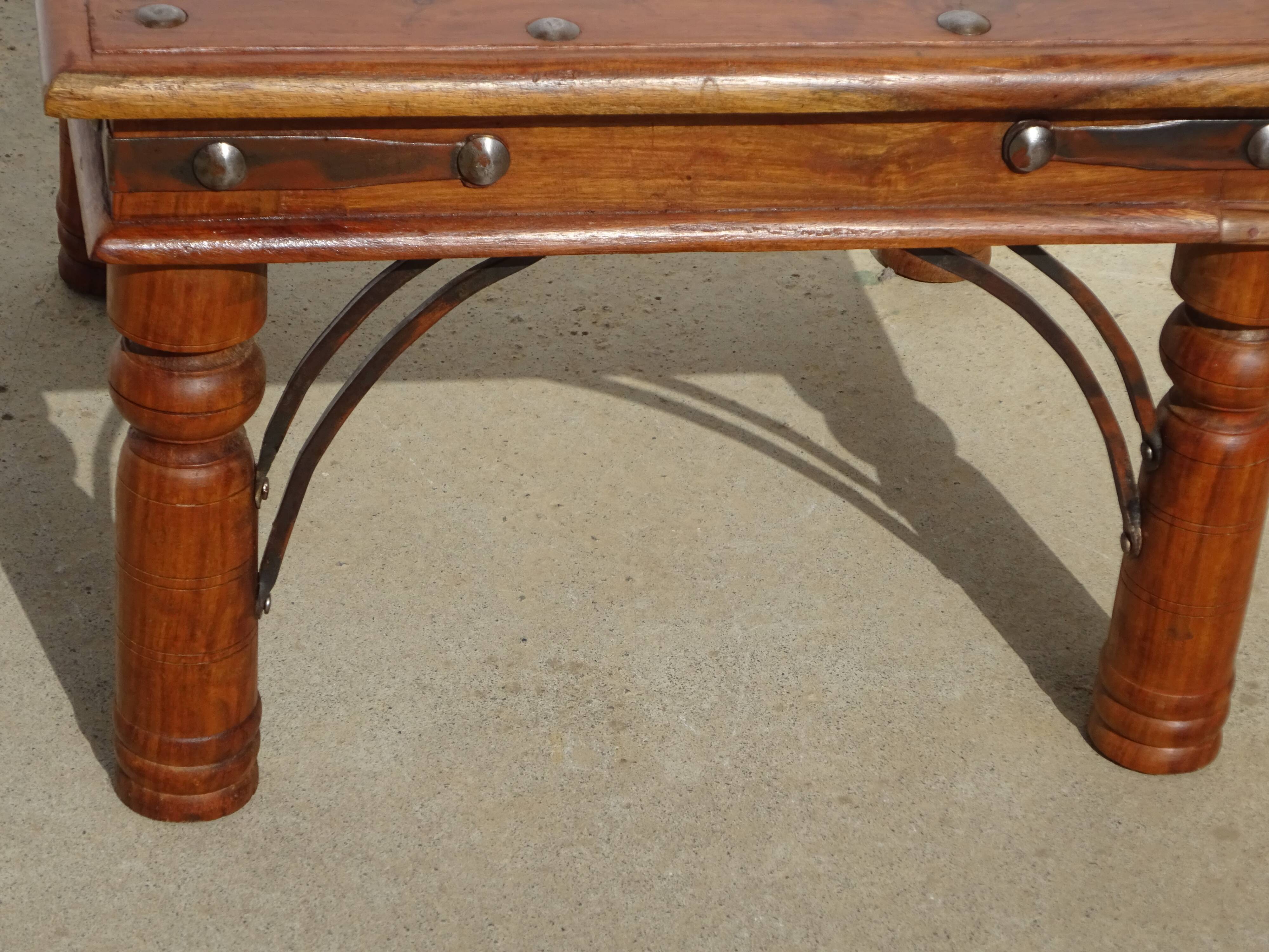 Square coffee table in exotic wood and wrought iron.