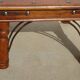 Square coffee table in exotic wood and wrought iron.