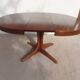 round/oval table with extension, central leg, dark shade, Baumann design