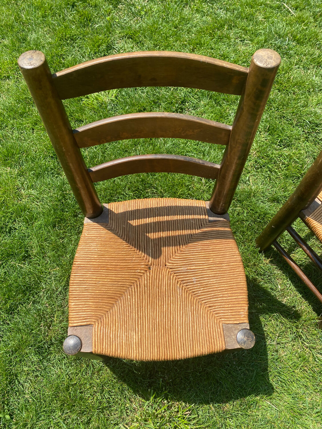 Pair of Georges Robert straw chairs