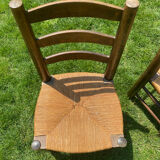 Pair of Georges Robert straw chairs