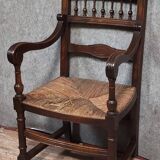 Renaissance-style armchair in solid wood, featuring a columned back