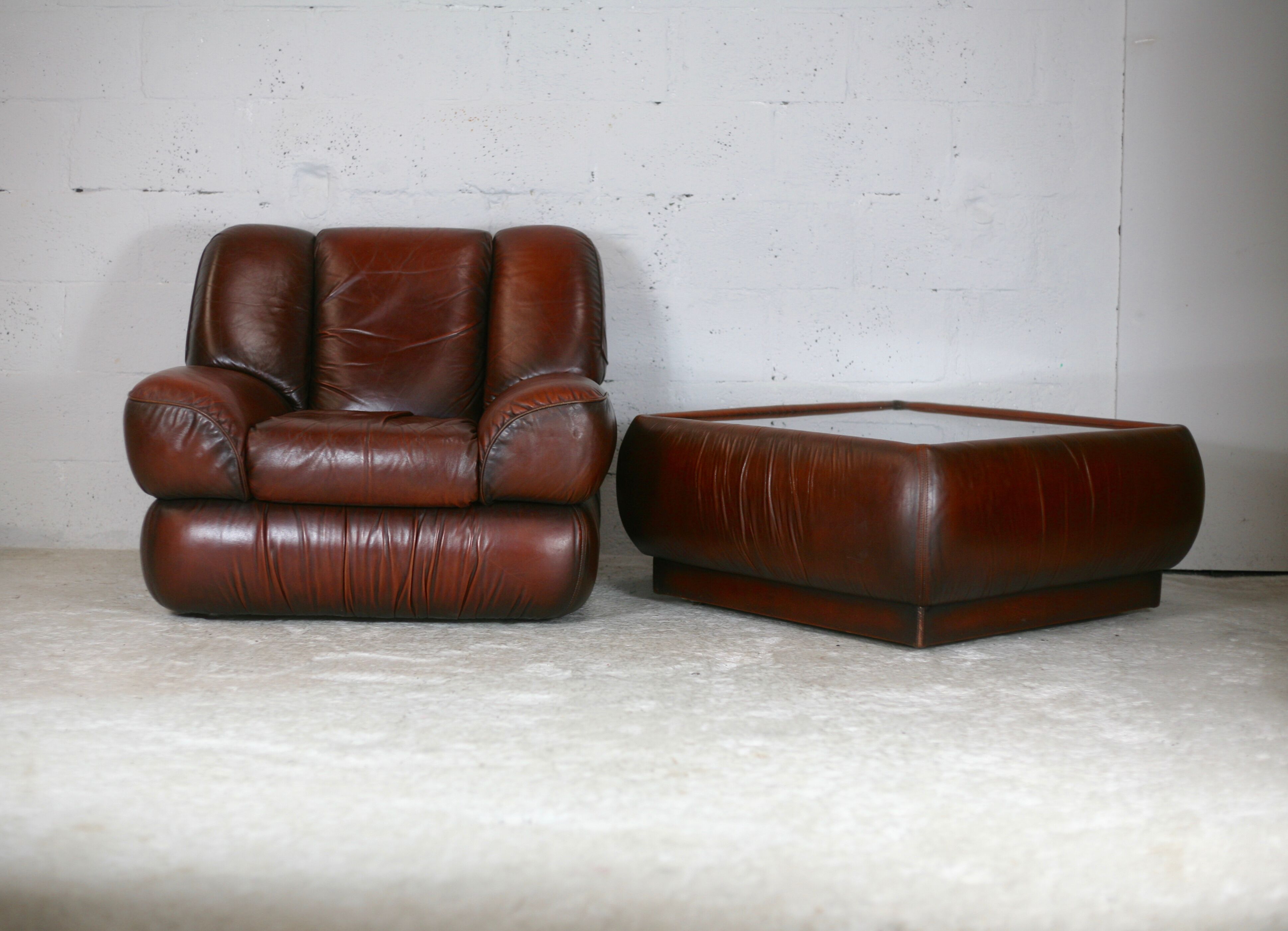 Leather armchair and coffee table set, Italy, circa 1970. Space Age