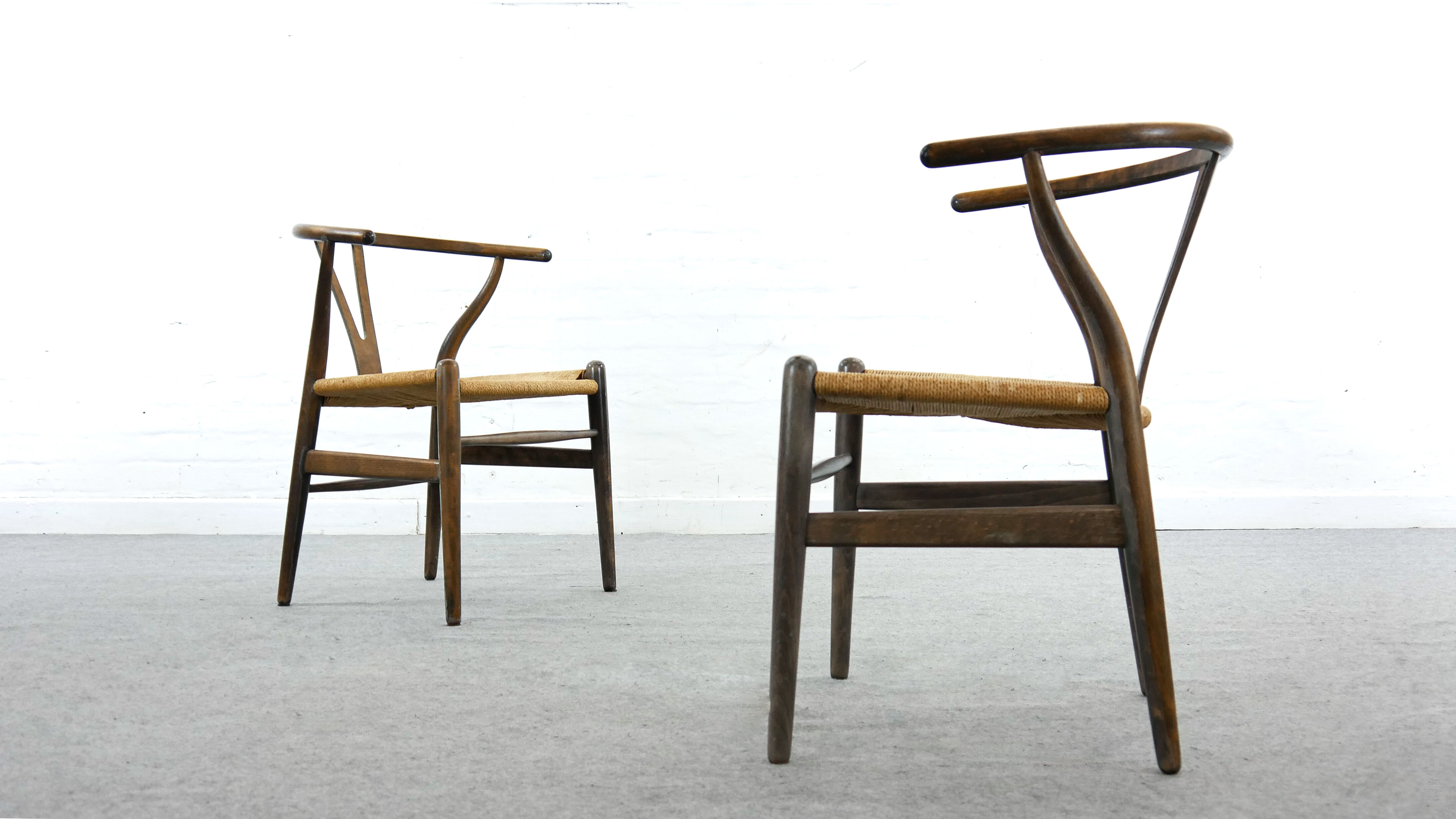 Pair of CH24 wishbone dining chairs by Hans Wegner for Carl Hansen Denmark