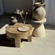 Petrified wood catchall or dish in beige with several grey spots in the centre.