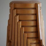 Modern Swedish, set of 14 stackable stools in birch and hessian fabric, 1980s.
