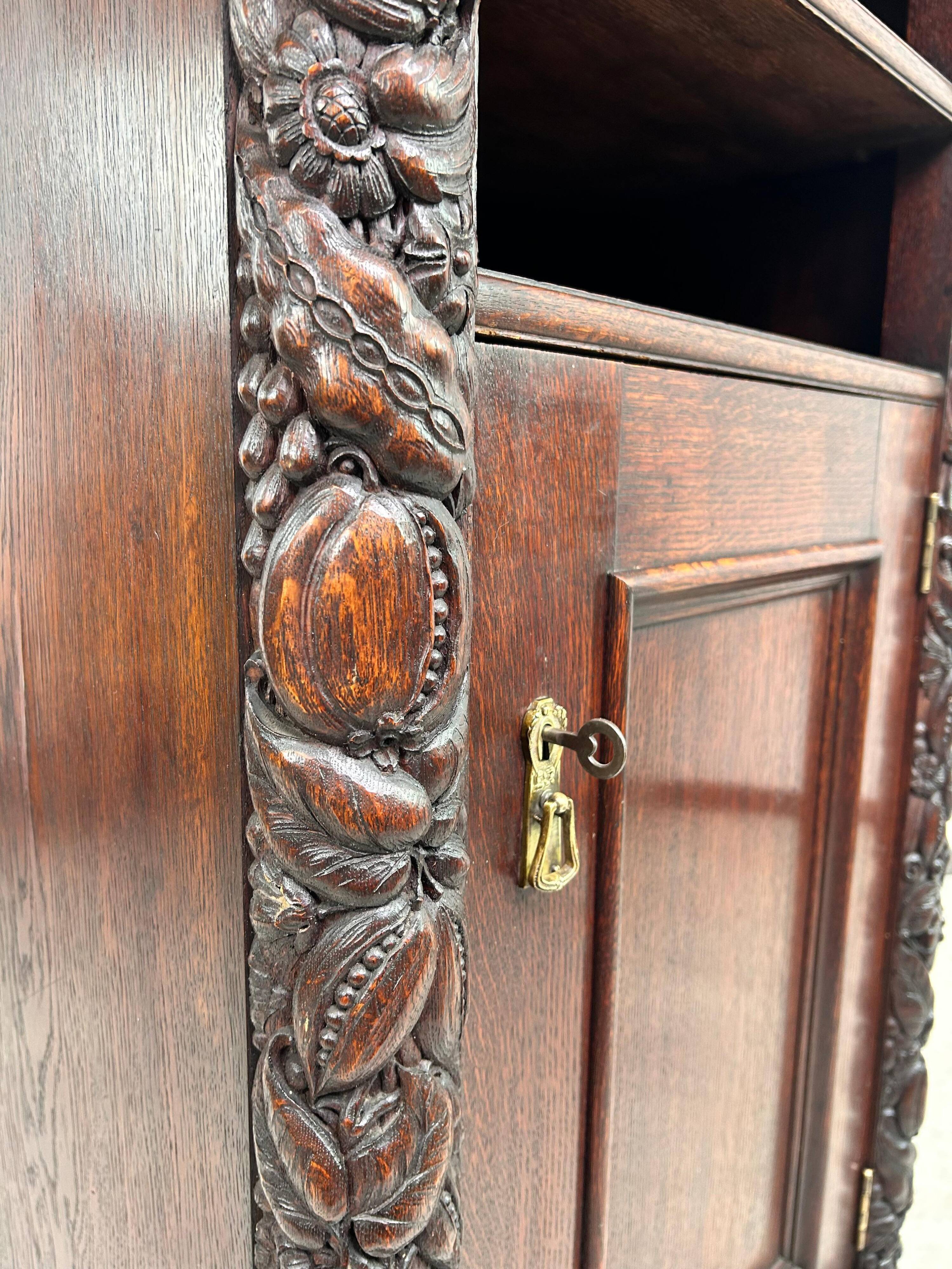 Art Nouveau cabinet with a shelf featuring distinctive floral sculptures.