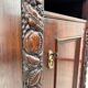 Art Nouveau cabinet with a shelf featuring distinctive floral sculptures.