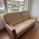 Beige leather sofa with solid wood frame