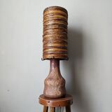 Table lamp with terracotta base and resin shade.