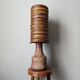 Table lamp with terracotta base and resin shade.
