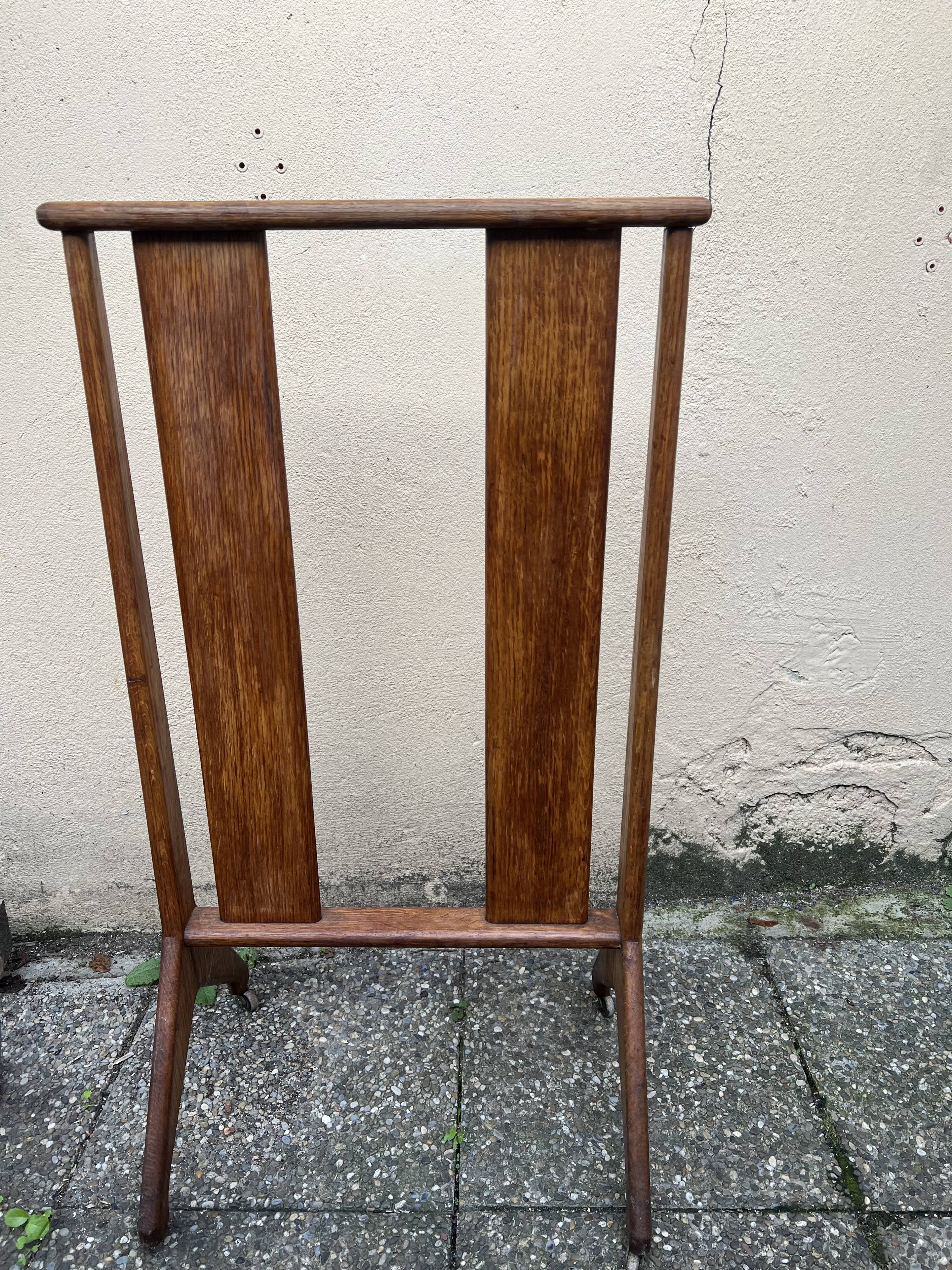 Old wooden shop rack valet casters