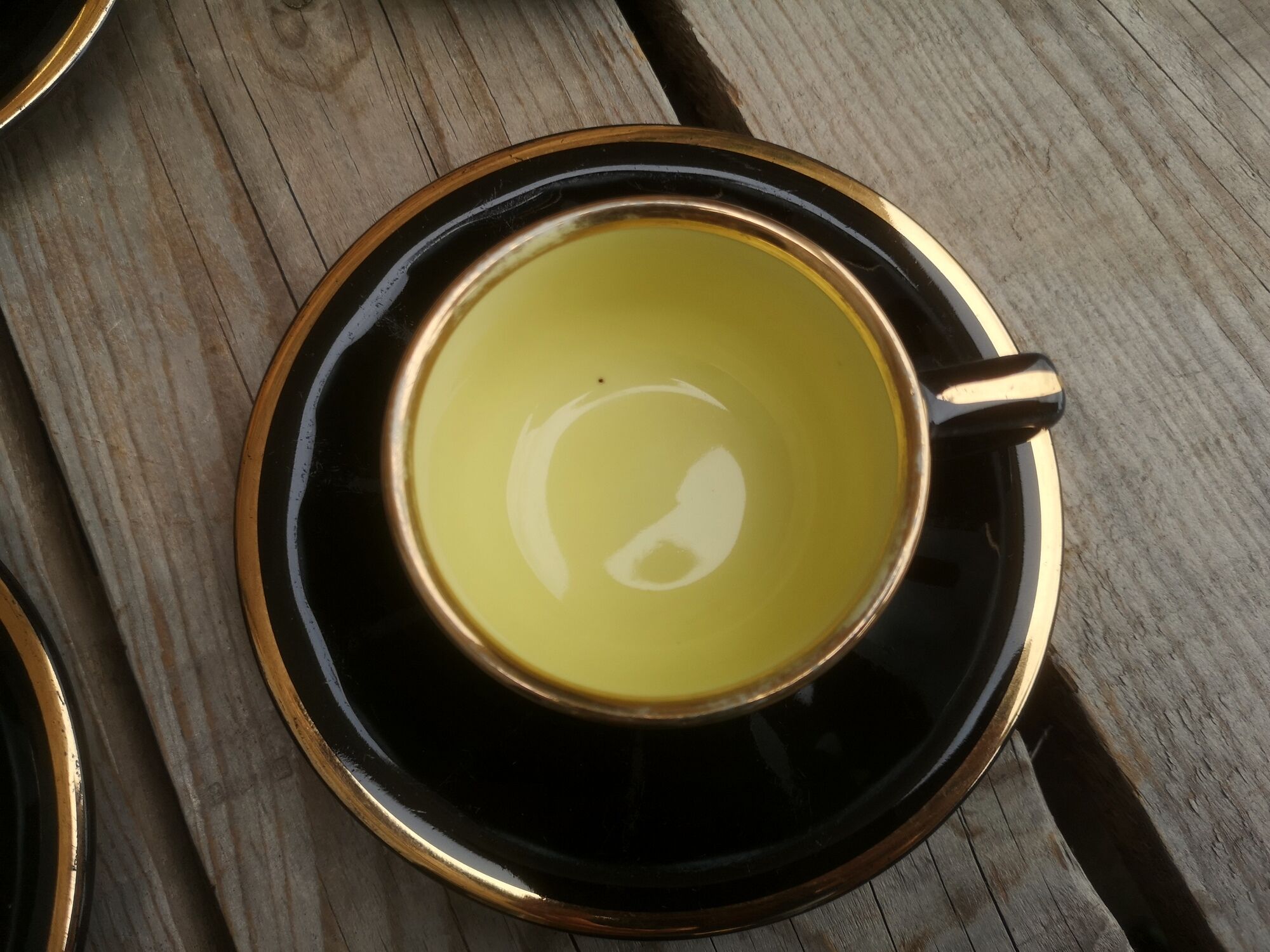 Set of 9 cups and sub-cups in black ceramic and colored gold border