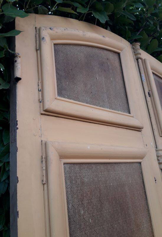19th century double arched entrance door in oak with grilles and old glass