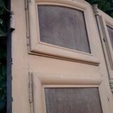 Porte d'entrée cintrée double en chêne, grilles et verre, XIXème