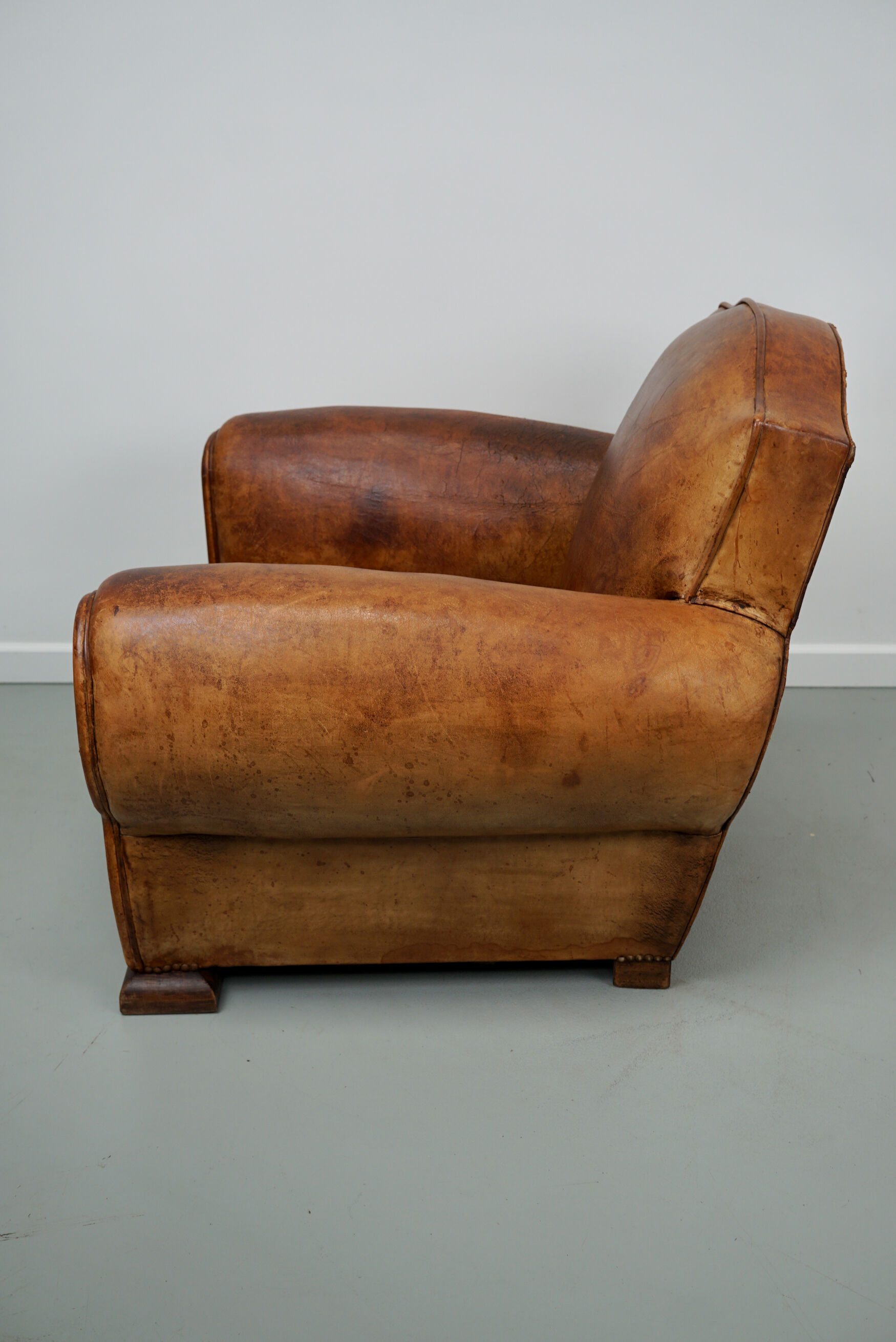 French moustache back cognac-colored leather club chair, 1940s