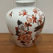 Vase decorated with birds and butterflies