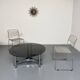 Round coffee table in smoked glass and chrome steel, 1970s design.