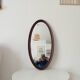 Oval antique mirror in solid wood from the 1960s.