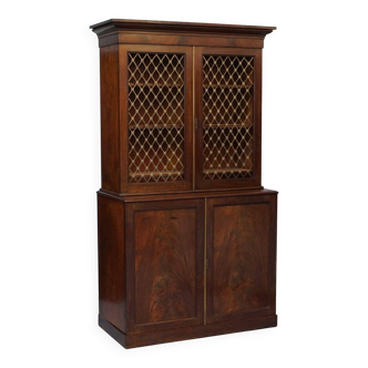 19th-century hardwood library with bronze metal doors and a chest of drawers.
