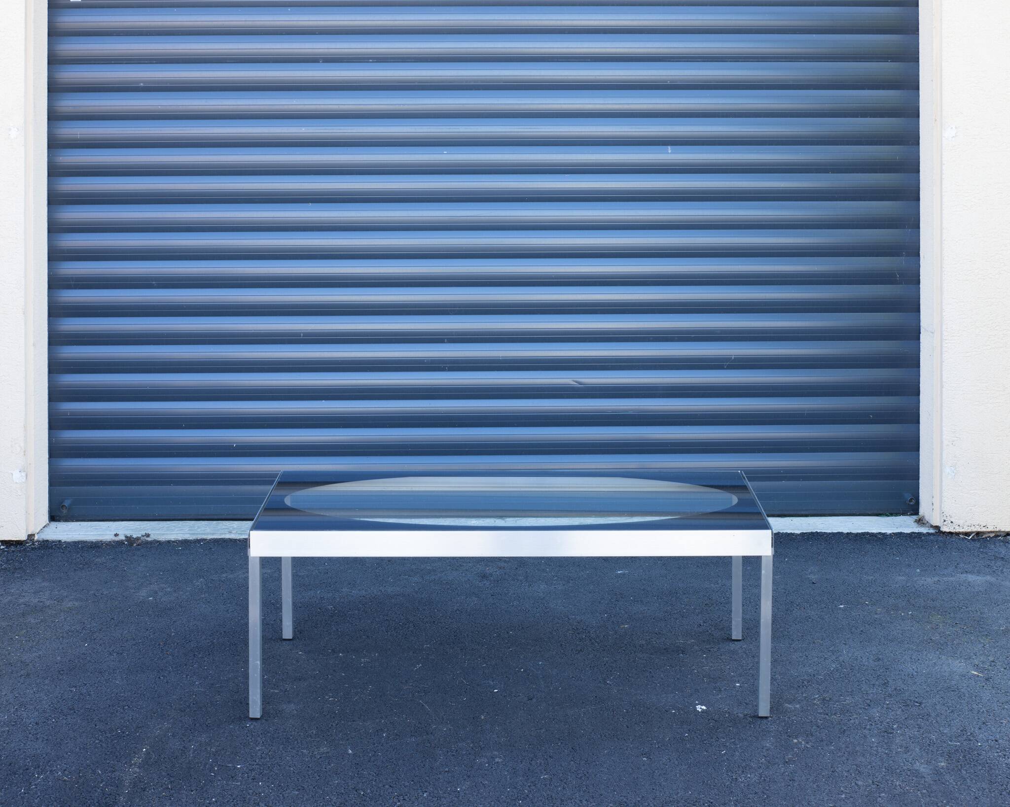 Glass coffee table with brushed aluminum legs, 1970