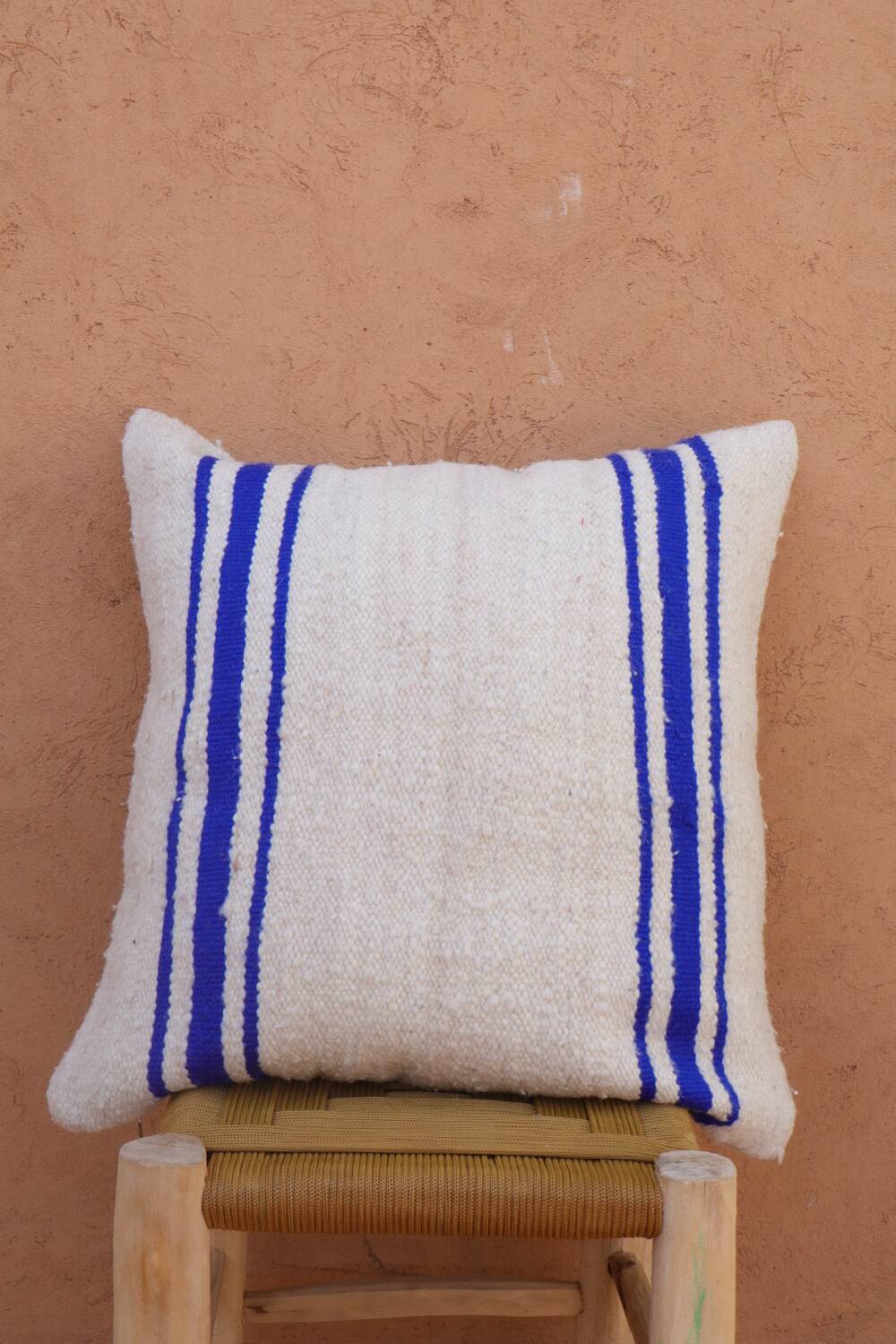 Blue and white striped wool cushion