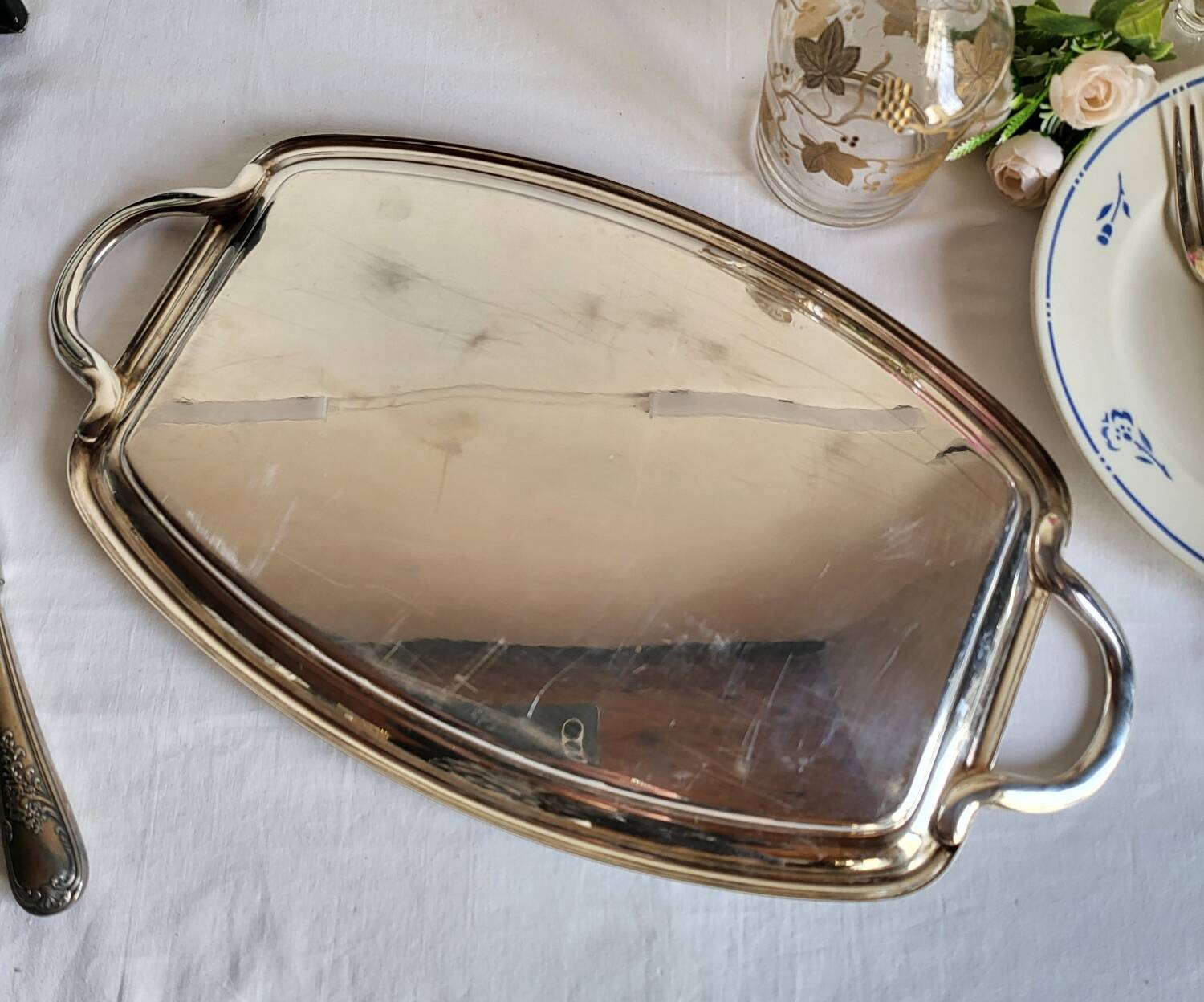 Silver-plated serving dish Quist and its asparagus cradle grid.