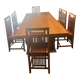 "Frank Lloyd Wright set with a table and its eight chairs."
