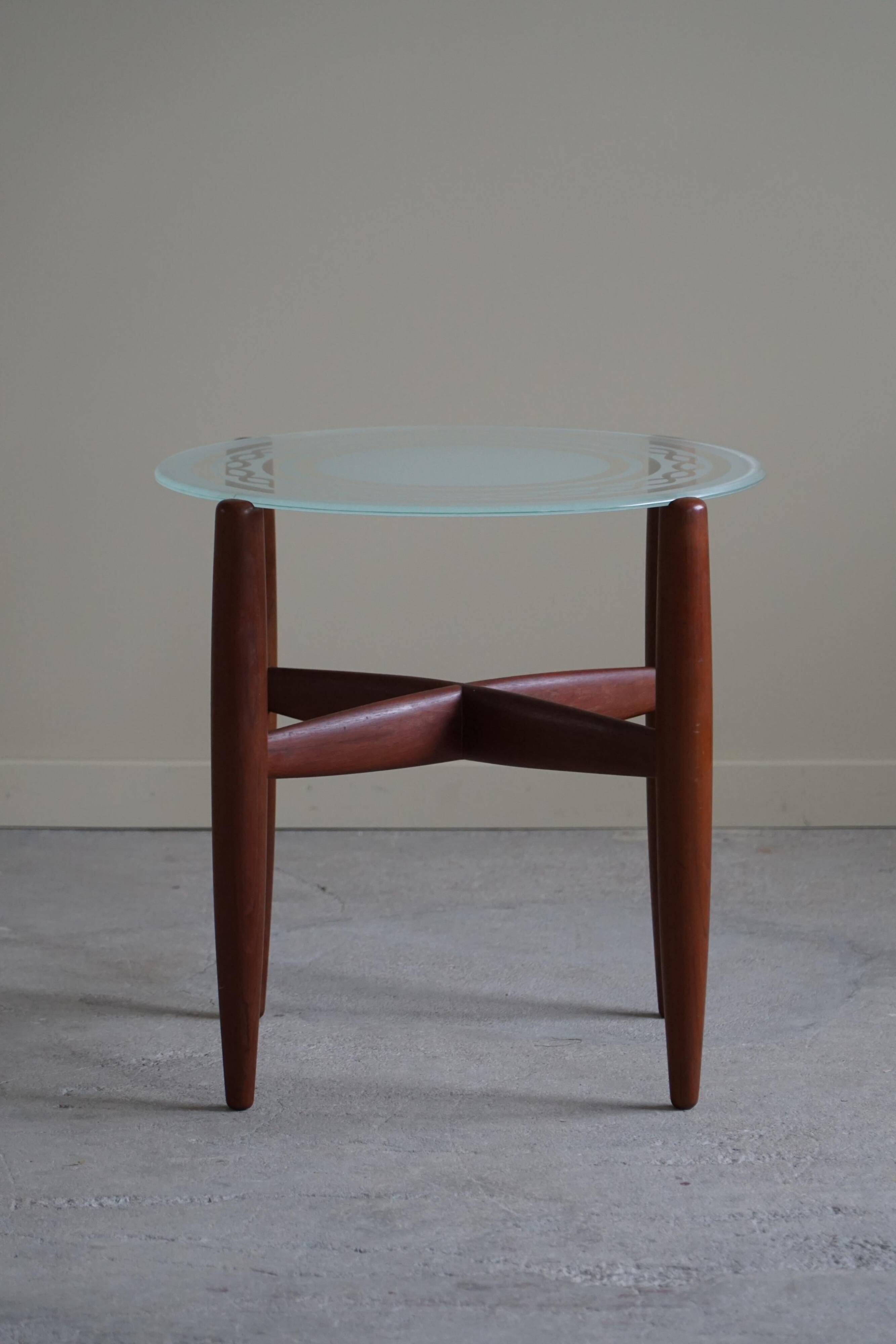 Teak and glass side table, mid-century Danish design, made in the 1960s.