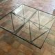 Design coffee table in glass and black metal – Geometric base