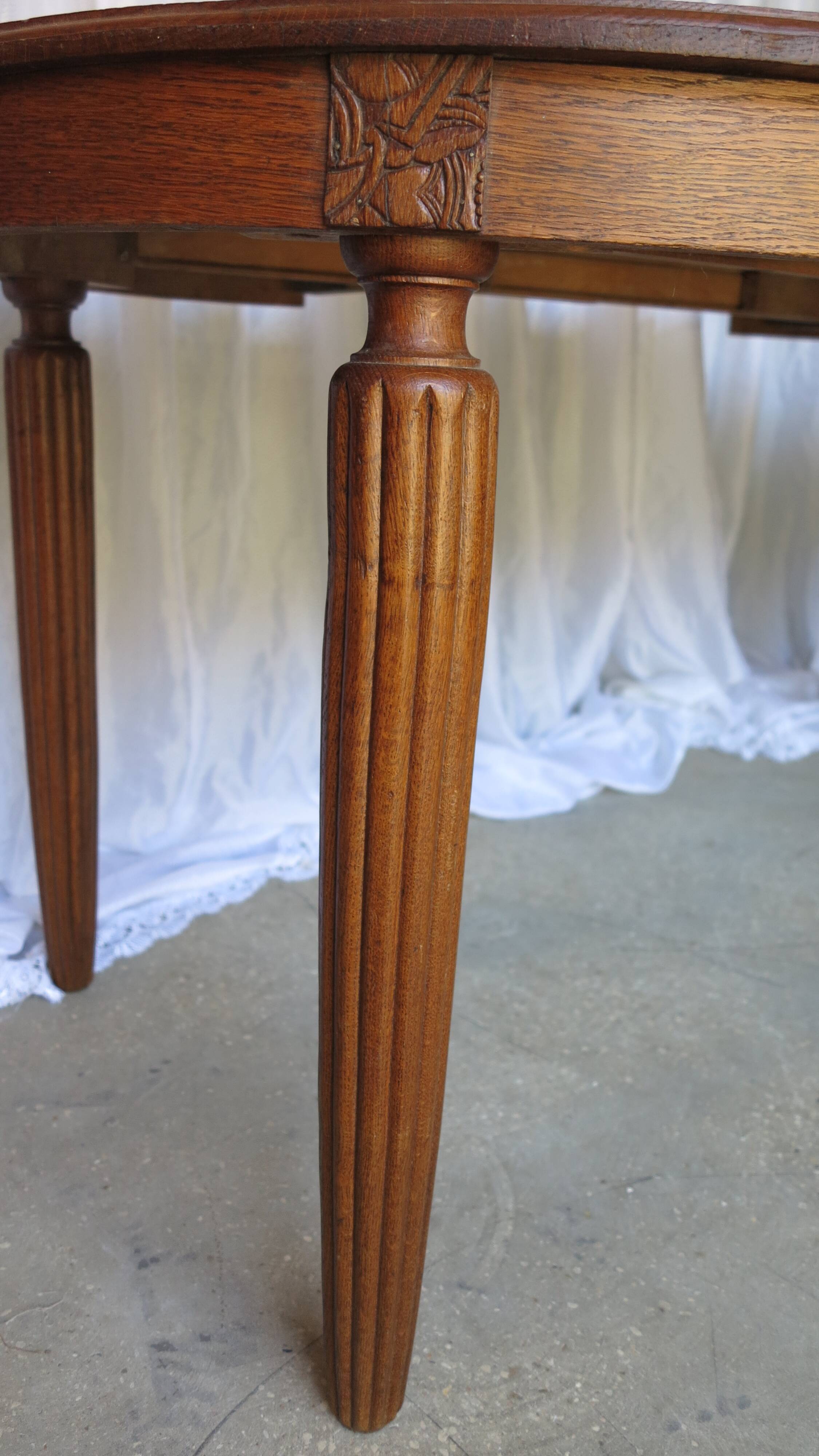 1930s oak dining table, slightly oval.