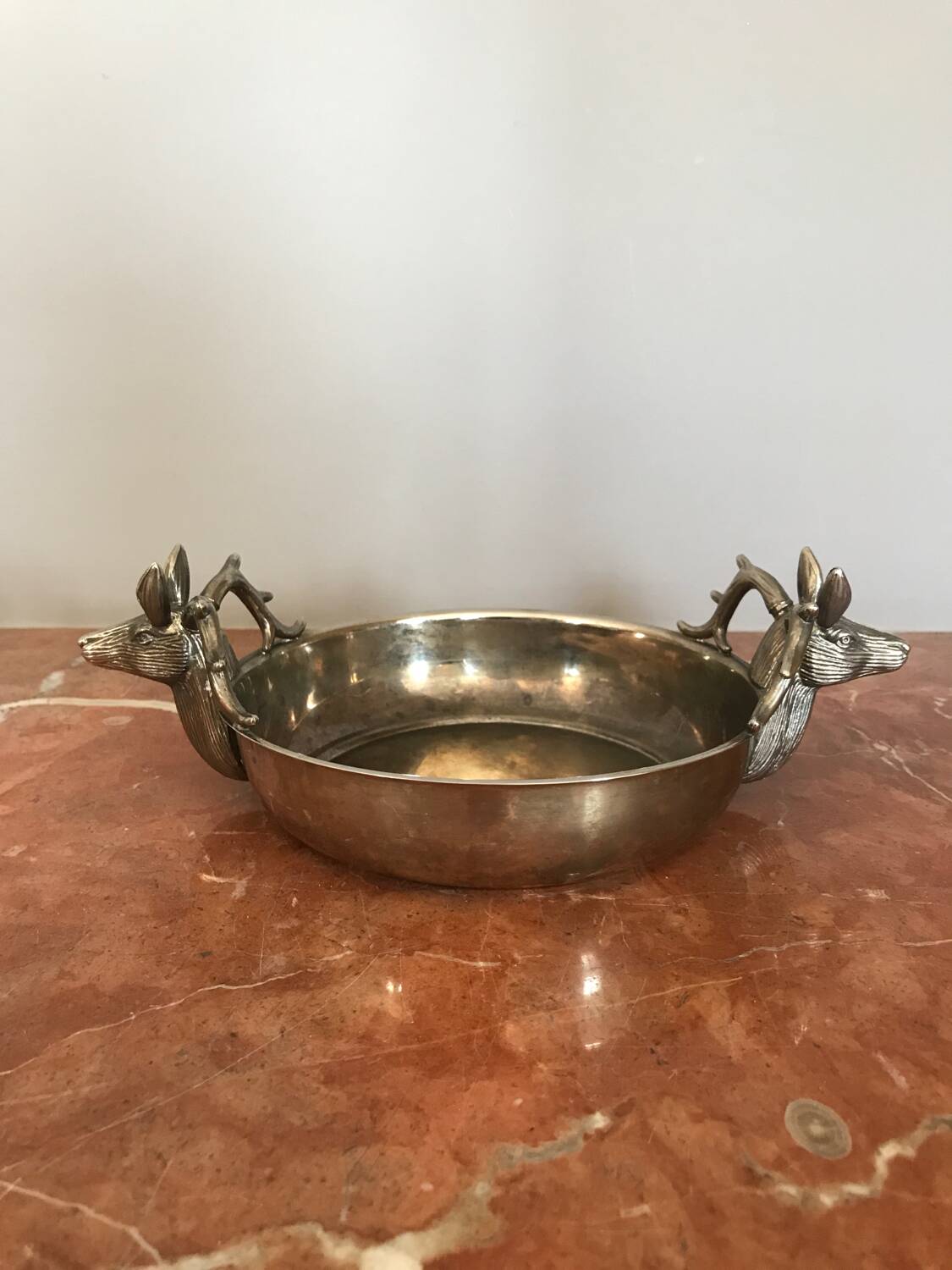 Empty silver metal pocket with deer heads