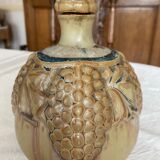 Wine pitcher in stoneware motifs grapes in relief signed Denbac