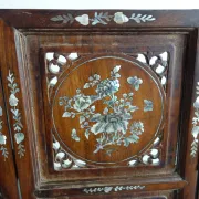 Asian screen in carved wood and mother-of-pearl marquetry.