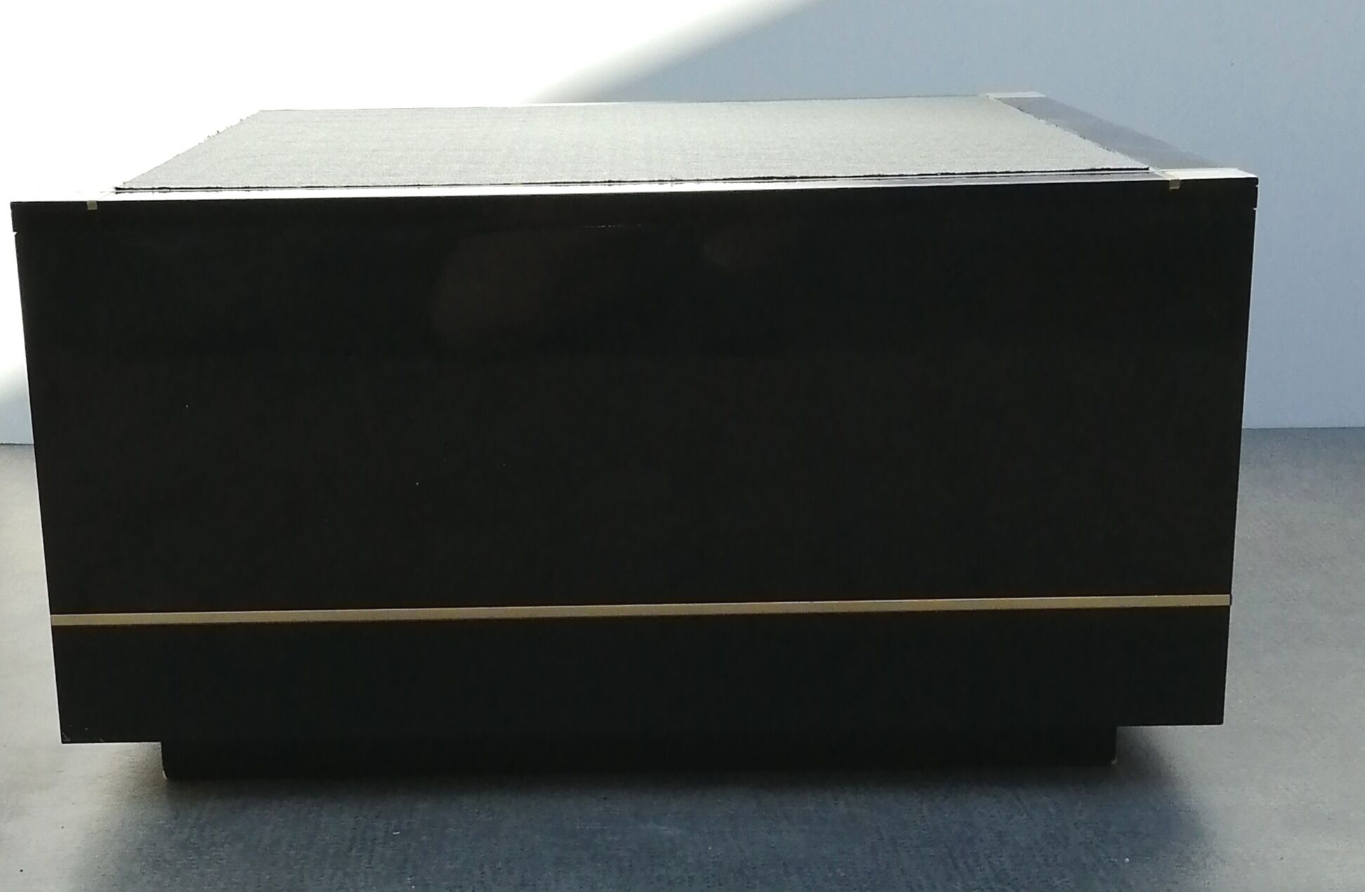 Designer coffee table in black lacquered wood and vintage brass