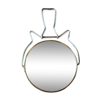 Antique round barber mirror in gilded metal