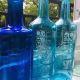 Lot of blue bottles: ricard pastis 51, spanish water, molded glass