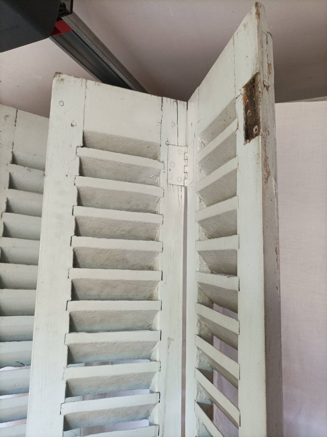 Louvered wooden shutter