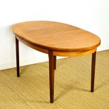 Oval teak dining table with extension