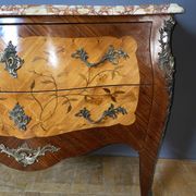 Louis XV style commode with floral marquetry decoration.