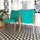 Fauteuil vintage bois et skaï vert