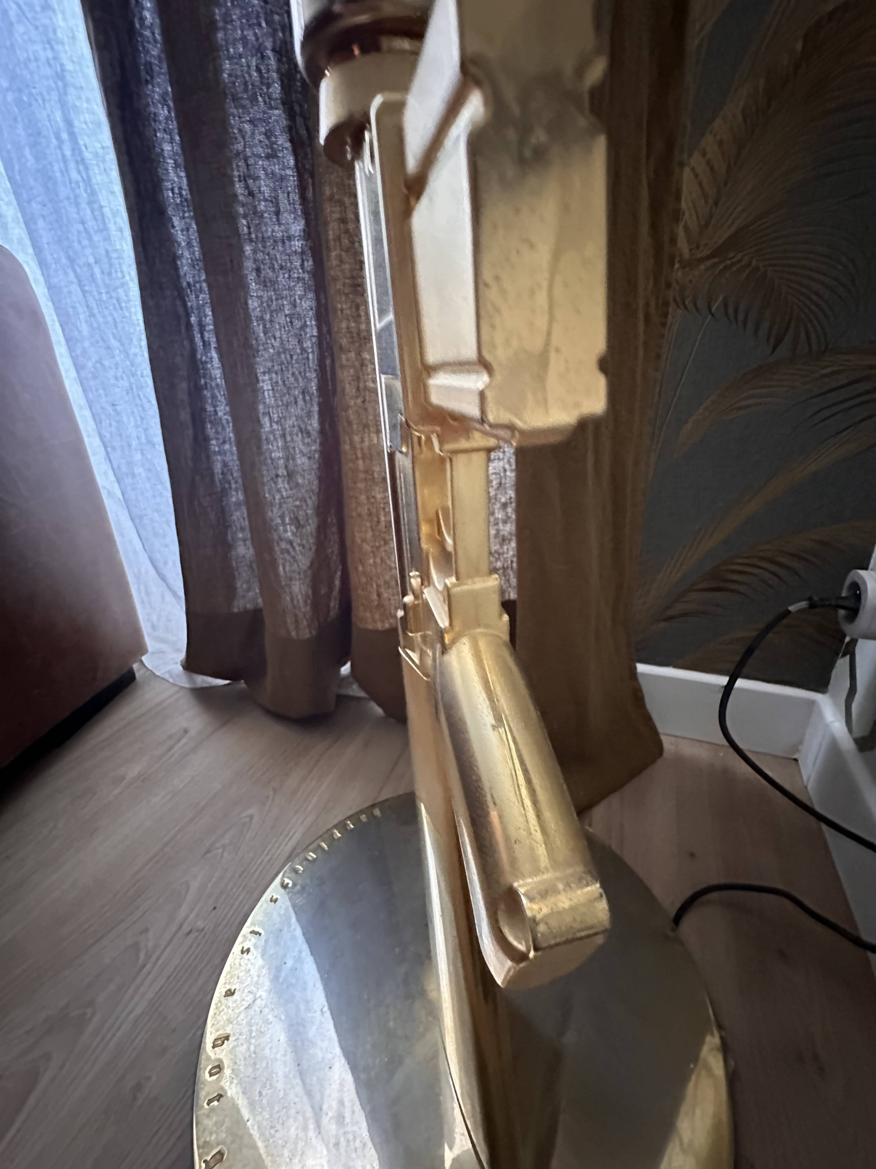 "Lounge Gun" floor lamp by FLOS by Philippe Starck – Gold