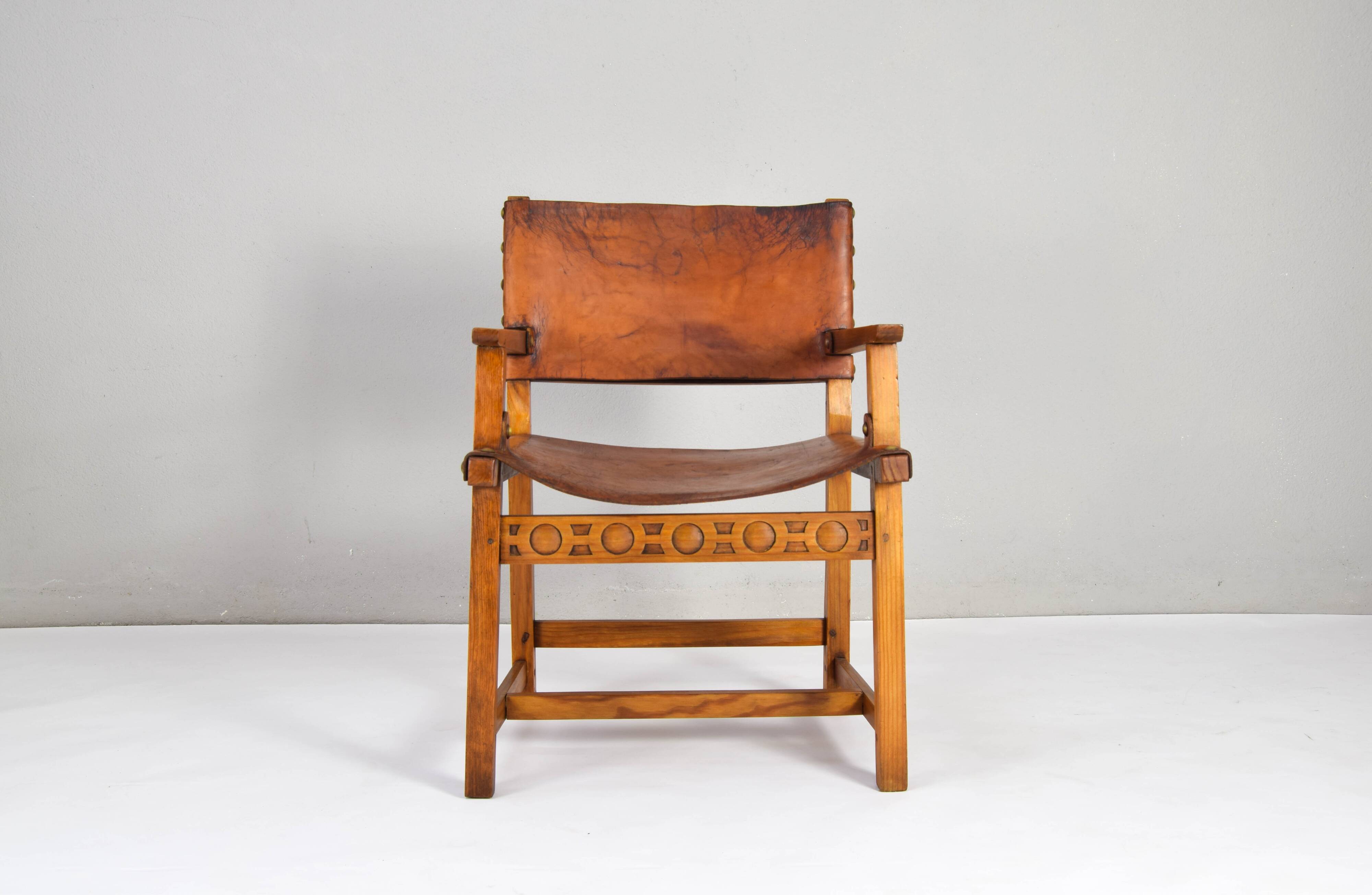 19th century oak and cognac leather brutalist castellana spanish armchair
