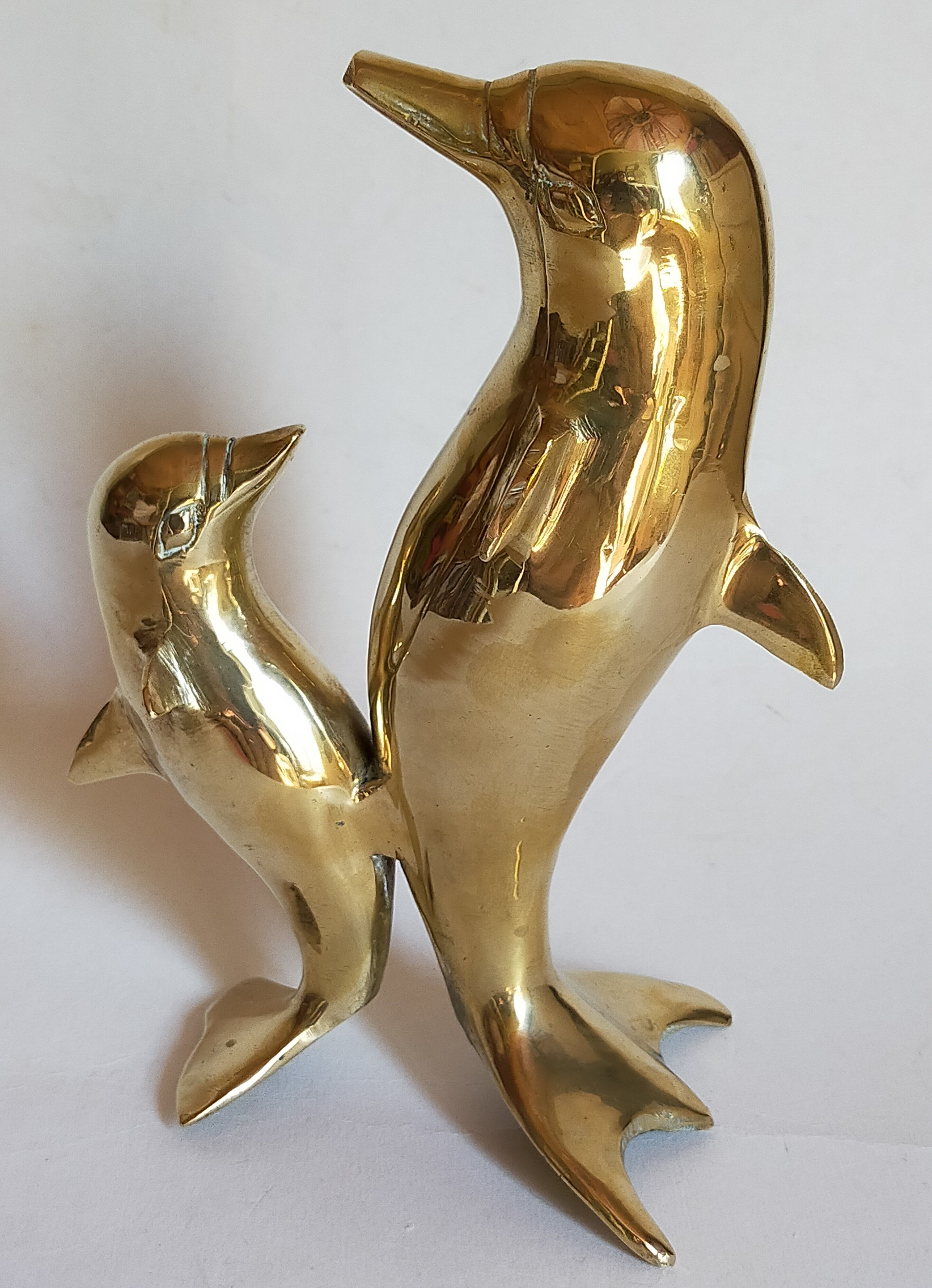 Vintage solid brass dolphins