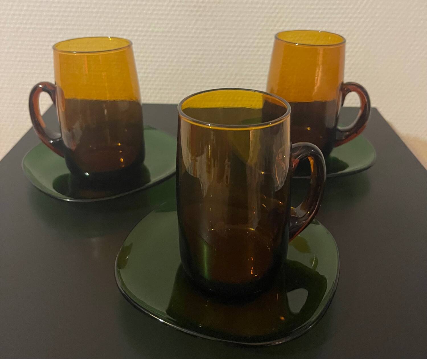 3 amber cups and green saucer