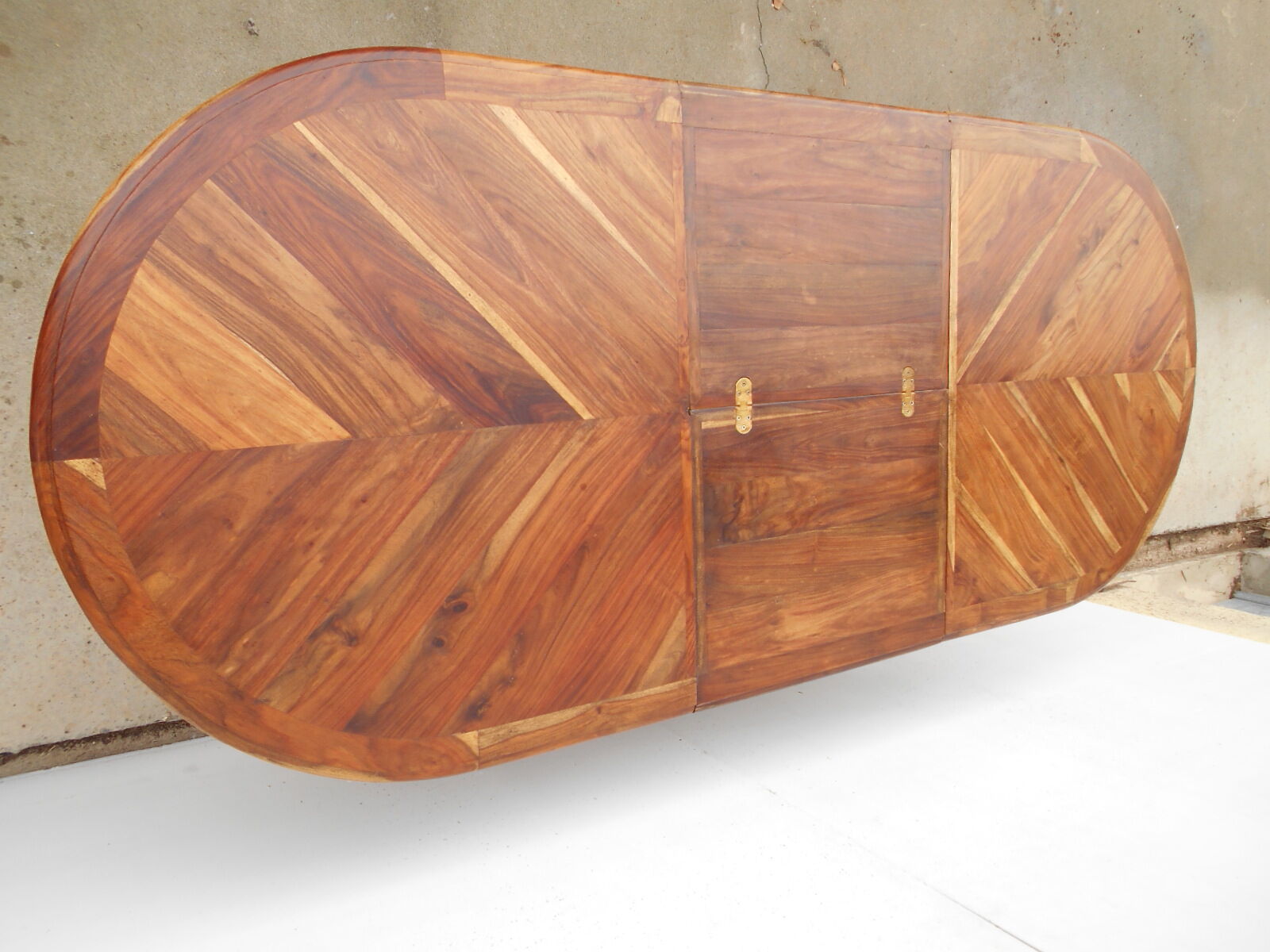 Oval table, integrated extension, in exotic wood