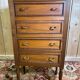 Louis XVI style molded and carved walnut chest of drawers
