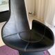 Fjord armchair by Moroso with its pouf, designed by Patricia Urquiola in 2002, made of steel and smooth black leather.