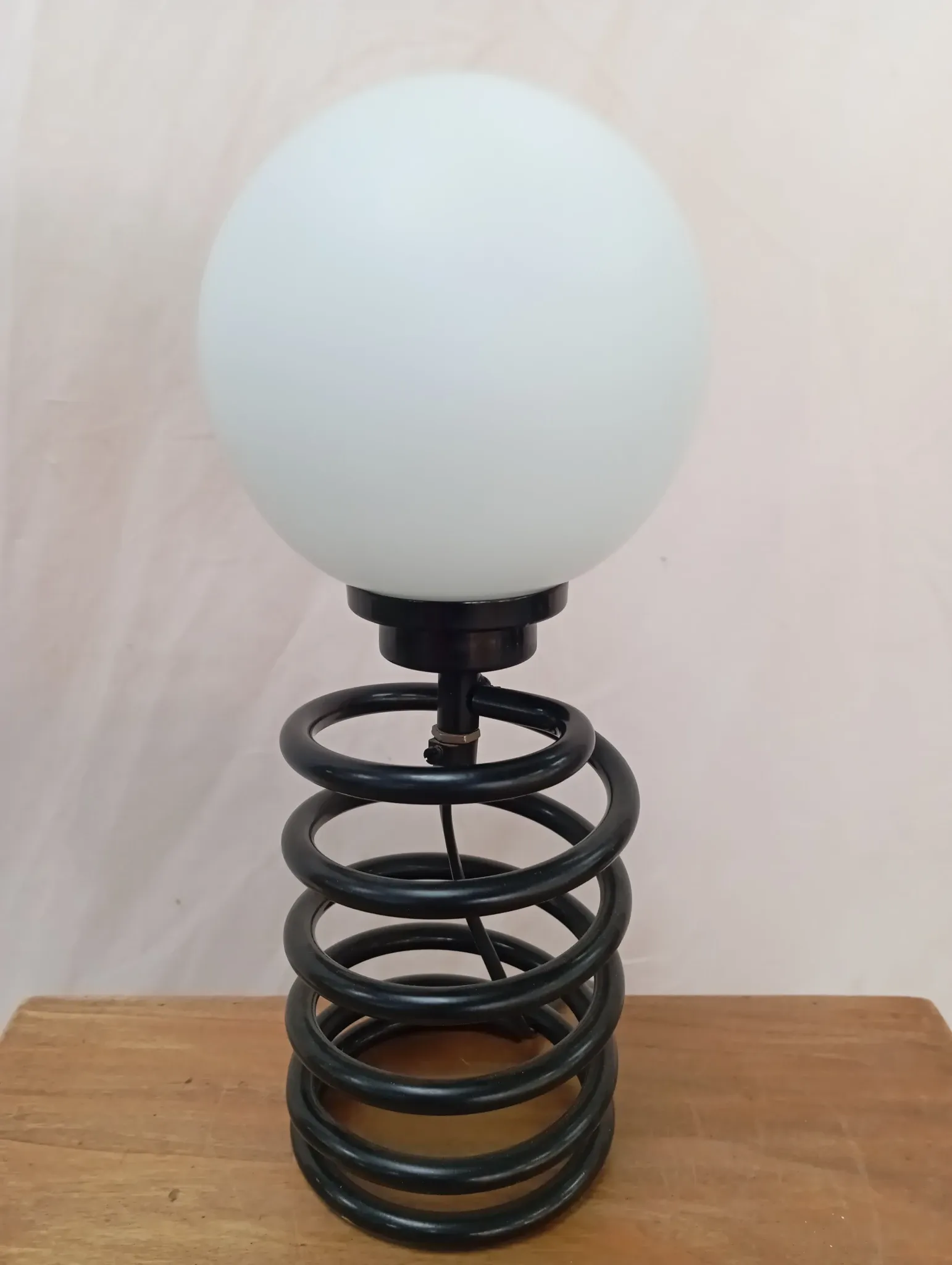 Spring lamp from the 1980s, design by Ingo Maurer.